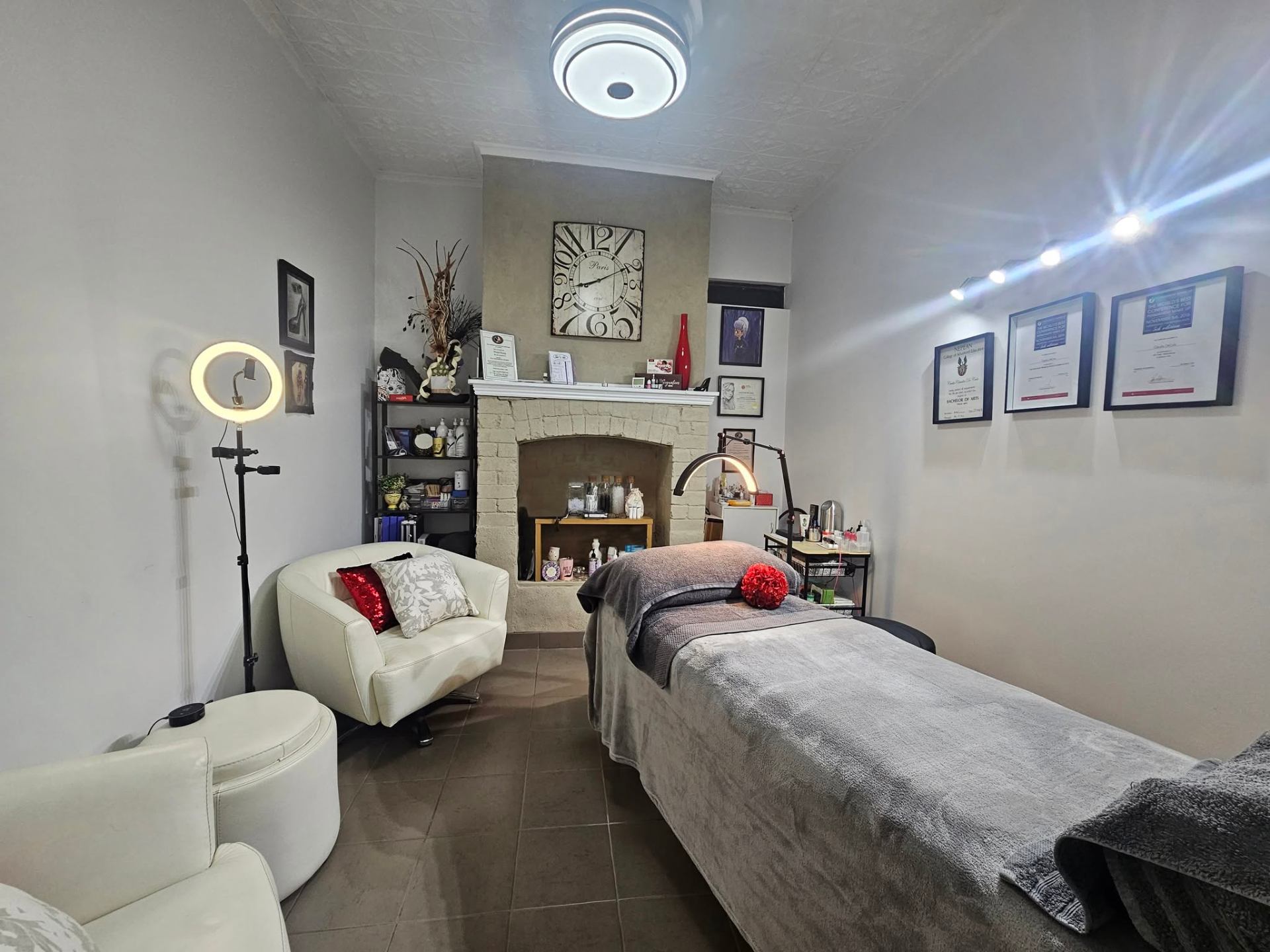 Interior of the cosmetic tattooing cottage with warm cream walls and linen curtains